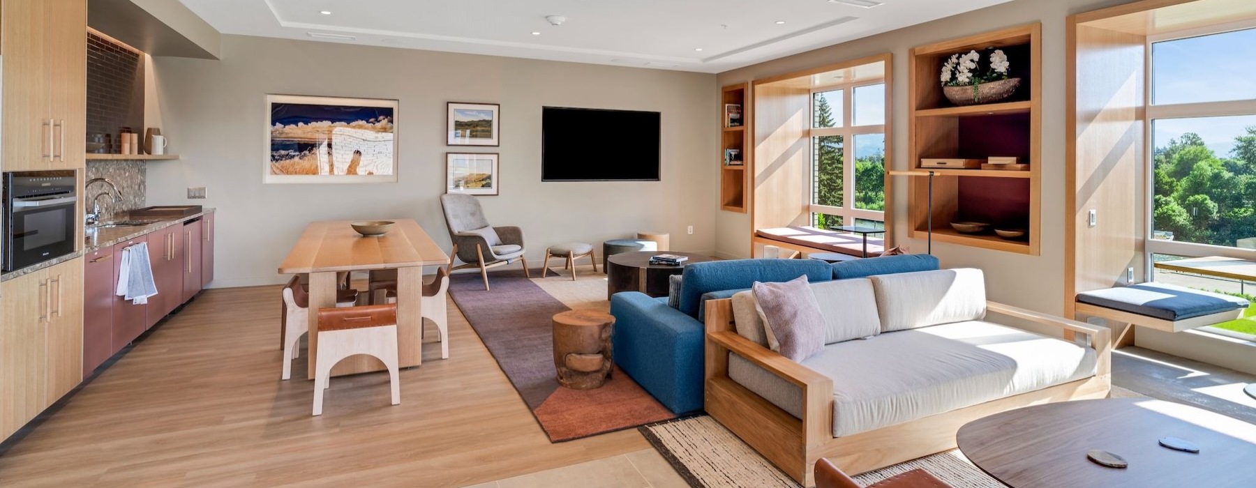 a clubroom with couches, tables and chairs