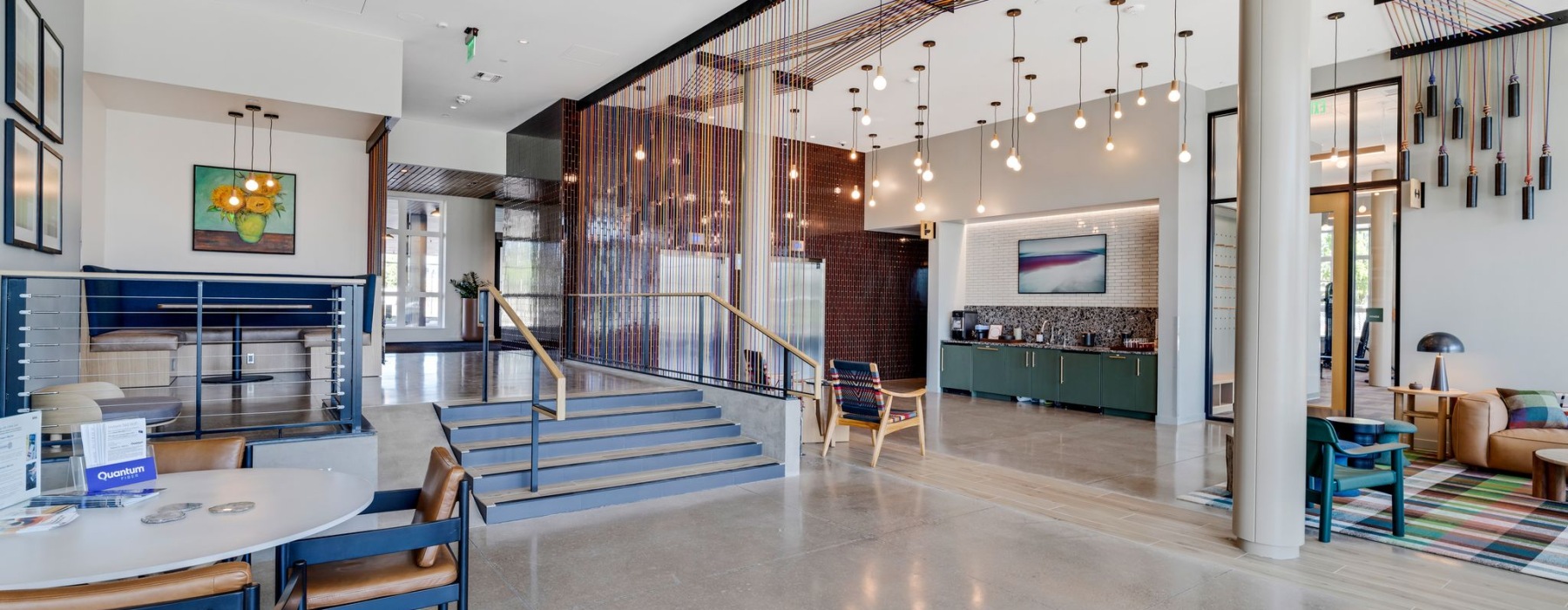 a clubroom with tables and chairs