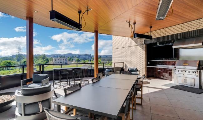 a patio with tables and chairs