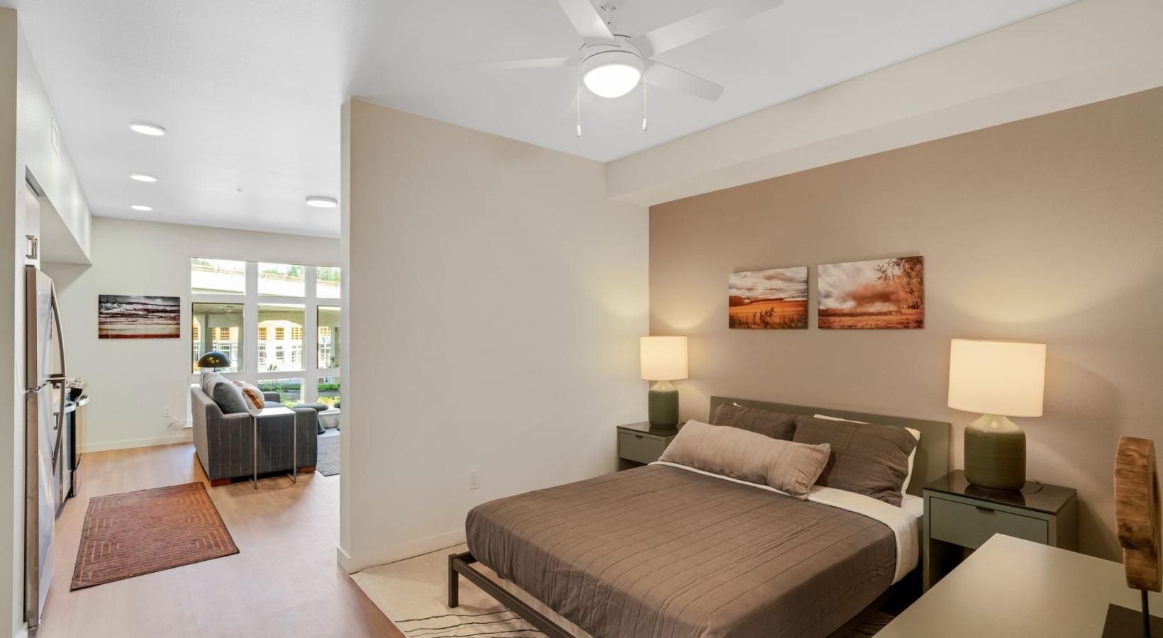 a bedroom with a bed and lamps